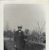 Dr. Chevalier Q. Jackson with dog, ca. 1920-1940