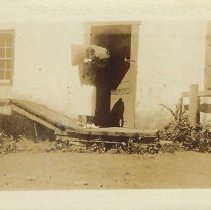 Alice Jackson in doorway of Sunrise Mill gristmill