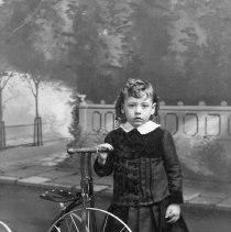 Unidentified child with tricycle.