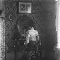 Lea Lachner at dressing table.