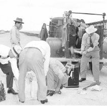 Men (including Johnny Klevenhagen) smashing gambling machines