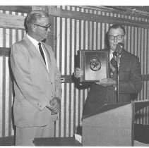 Clint Peoples presenting Eddie Lee Oliver with plaque
