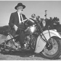 John R. Hughes on Highway Patrol Motorcycle