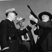 John R. Hughes and the Submachine Gun, 1940
