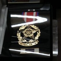 Tom Arnold's Medal of Valor on display