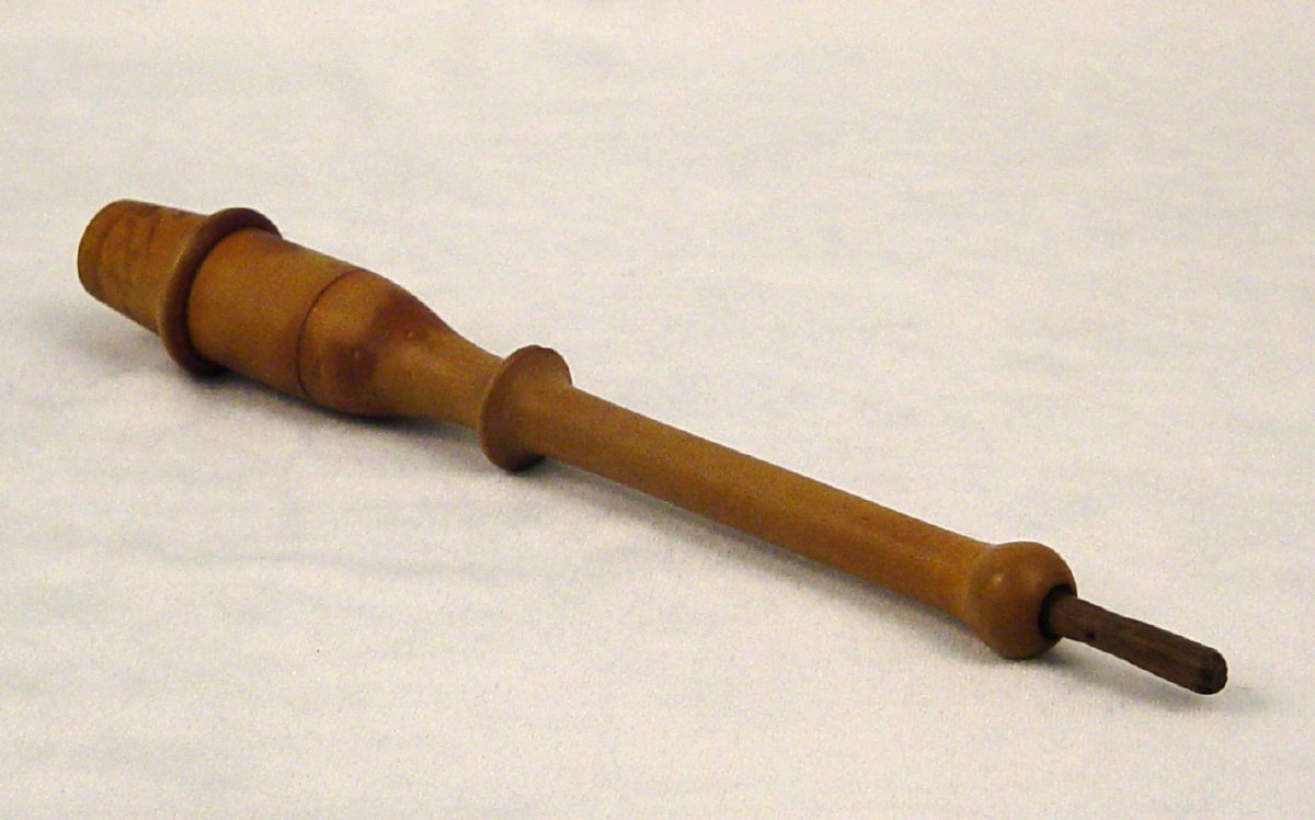 Lebenswecker, made of wood with a long stem and a wooden cap.