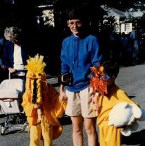 Zachary, Joshua, and Lorraine Hayes Holding Hands in Children's Parade