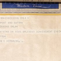 A congratulatory telegram to Hall, Post, and Gatty from Dr. M. E. Reynolds.