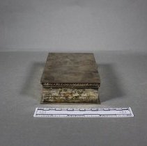 Silver cigarette box, side view