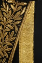 Detail of tail and pant leg