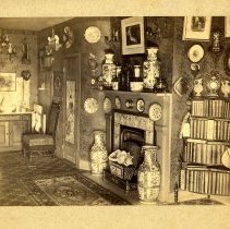 E. Alice Austen, [Bedroom Fireplace and corner bookcase] 1887