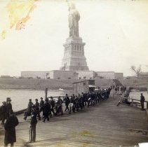 E. Alice Austen, [Line of Soldiers on Docks of Liberty Island], 1887.