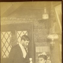 [Alice Austen and a man in formal attire at Clear Comfort], ca. 1890
