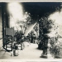 E. Alice Austen, [Gertrude Tate in Hammock on the porch of Clear Comfort]