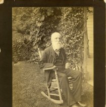 E. Alice Austen, [John H. Austen in a rocking chair], 1890.
