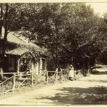 E. Alice Austen, [House beside a road & Woman], 1889.