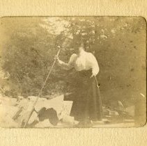 E. Alice Austen, [Gertrude Tate in the sun holding a stick], ca. 1899.