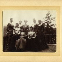 E. Alice Austen, [Eight women on a porch in the Catskills], 1899