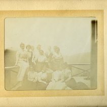 [Large group posed on porch in Catskills], 1899