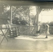 E. Alice Austen, [Little girl on a sunlit porch], ca. 1890