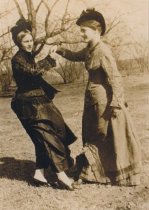 Ophelia and Flora Steele play dress up in their grandmother's clothes, 1926
