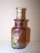 Irridescent amber glass bottle