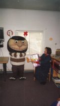 Janice Cambell leads a storytime with the help of a "wild thing"