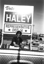 Carol Haley poses with one of her Dist 14 Representative campaign signs