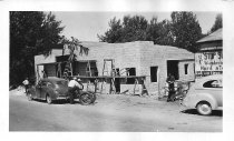 Several workers help construct the new 1940s Cullen machine shop