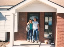 Two unidentified employees in front of city hall