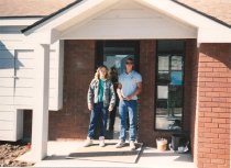 Two unidentified employees in front of city hall 2