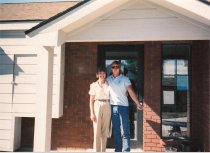 Barbara Montgomery & unidentified employee in front of city hall
