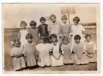 Middle grade girls posing on the grounds of Pleasant View School
