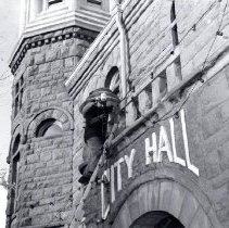 Holidays Ahead Joe Velikaneye hangs Christmas Lights
