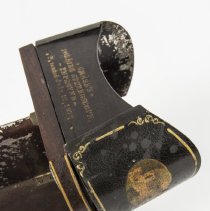 Caption on the wooden fold up brow shield