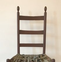 Enfield side chair with tattered old tapes.