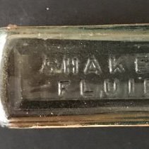 Side embossed "Shaker Fluid"