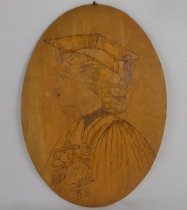 Front, oval wood burned portrait