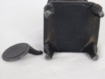 Base view of toy pot bellied stove