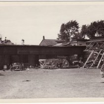 Raymond St., shed & wagons, 1920's