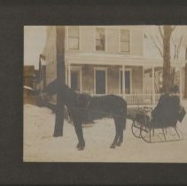 Unidentified Couple in Sleigh in front of 65 Elm Street in Potsdam