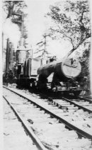 Donkey engine with two water tanks on railroad cars, and Lawson Flyer, Greenwood.