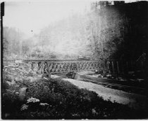 Elk Creek Railroad locomotive on bridge.