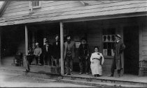 Group posed in front of store/saloon/post office in Melbourne.