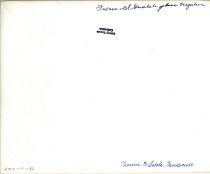 Logging crew with big log hauled by steam donkey