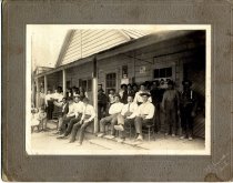 Group Posed in Front of Store/Saloon, Melburne, CA.