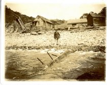 Bill Wilson and his cabin, south end of Little River Beach. Sunol wreckage washing up on beach.