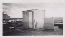 Black and white photograph of Kress rooftop with access door visible