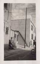 Black and white photograph of Kress back alley