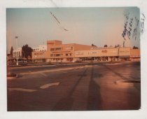 Black and white photograph of Kress store front and surrounding stores indi